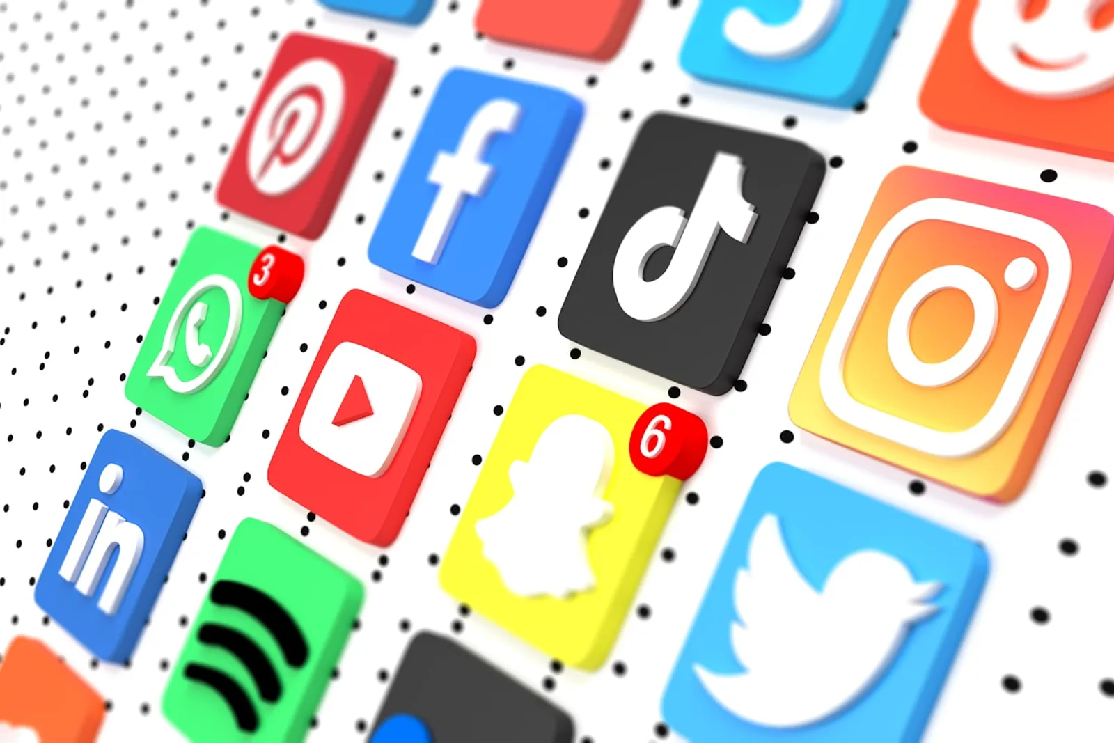 A smartphone displaying social media apps in a dark, low-light setting